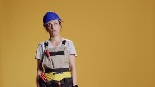 Portrait of Female Builder Being Hit in Head and Feeling Dizzy