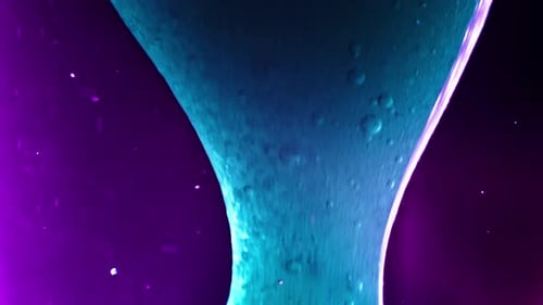 Colorful liquid mixing in vibrant close-up, creating abstract patterns with smooth motion