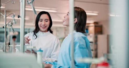 Scientists Collaborate on Experiment in Laboratory