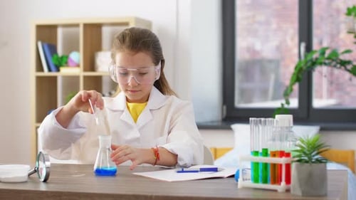 Girl Scientist Experimenting with Beakers at Home