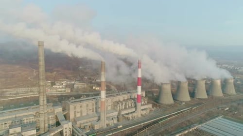 Aerial Orbital View of an Industrial Zone Pipes Pouring Thick White Smoke Thick Smoke Plumes Thermal