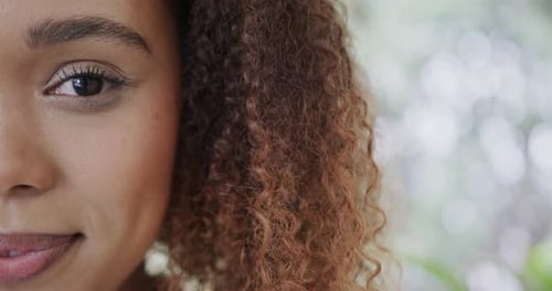 Beautiful Woman with Curly Hair Smiling Close Up