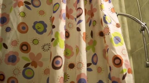 Shower Head Dispensing Water in a Bathroom Setting