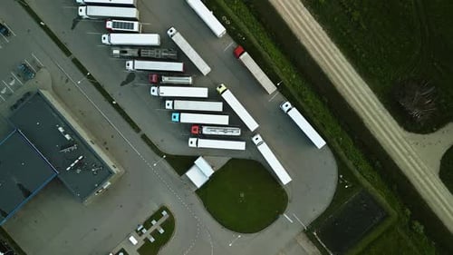 Aerial View of a Truck Parking Lot Filled with Semitrailers Showing Logistics and Transportation