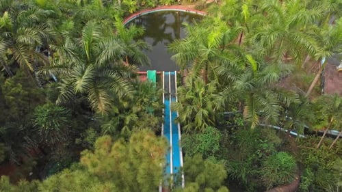 Topdown view of old abandoned waterslides at Thuy Tien lake Abandoned Water Park, aerial