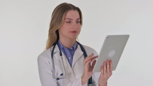 Woman Doctor Using Digital Tablet in Hospital Setting