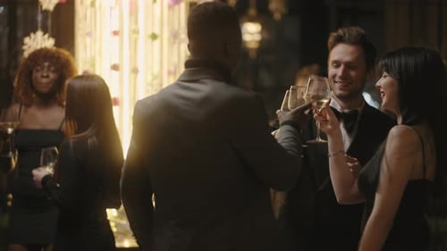 Group celebrating at an urban party with toasts