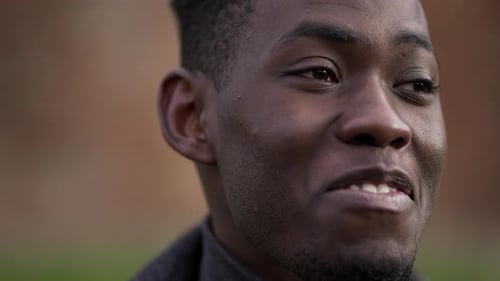 Positive emotion, black african man smiling close-up face