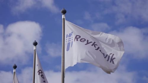 Flags of Reykjavik Waving Against Blue Sky
