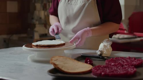 Chef Frosting a Cake in Commercial Kitchen