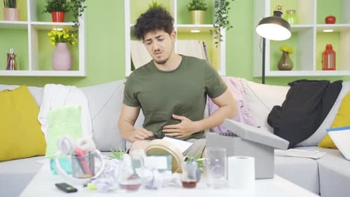 Young Adult Feeling Ill and Eating an Apple