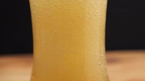 Close Up of Frothy Beer Poured in Glass