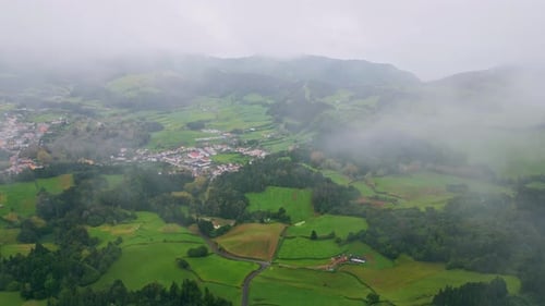 Low Clouds Covering Vegetation Mountains Drone View Countryside Houses Slopes