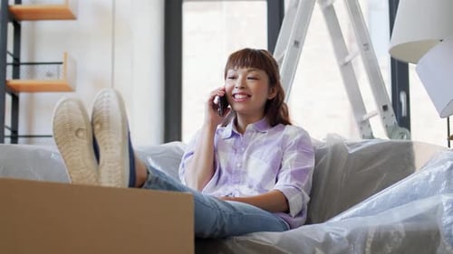Woman Relaxing on Couch Talking on Phone