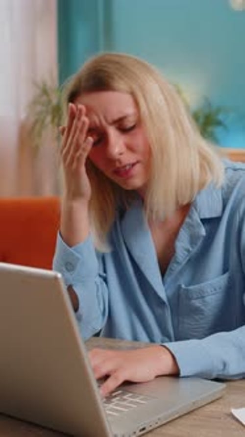 Tired Ill Businesswoman Suffering From Headache Problem Tension Migraine Stress at Home Office Desk