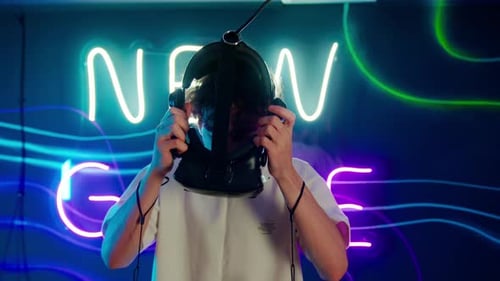 Young Adult Puts on VR Headset for Gaming