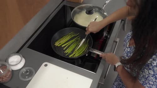 Adult Cooking Asparagus in the Kitchen