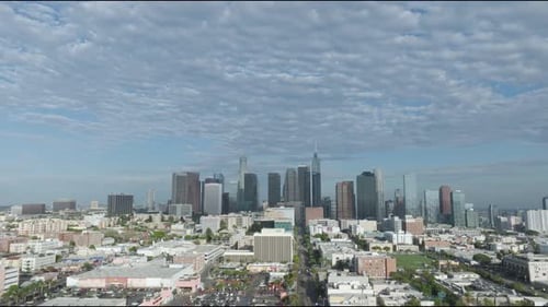 Aerial view of the vast Los Angeles skyline, highlighting the city's iconic landmarks and dynamic ur