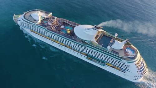 Aerial view of a beautiful white cruise liner in a sunny day.