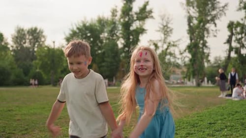 Cheerful Kids Running Smiling in Park Grass