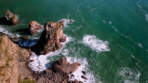 Rugged Coastline with Cliffs and Crashing Waves