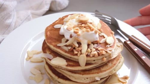 Pancakes with Almonds and Cream for Breakfast