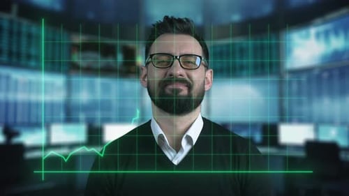 Smiling Man With Glasses In Front of Computer