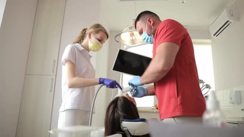 A Dentist Treats Teeth in a Modern Clinic Pain in the Teeth Painless Dental Treatment