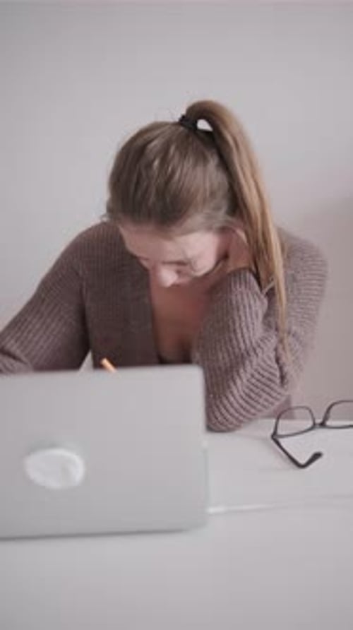 Tired Business Lady Working at Home Using Laptop Serious Girl Works Remotely Sitting in Home Office