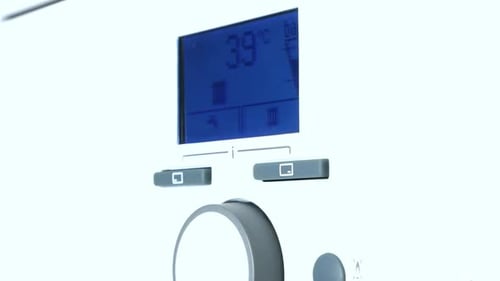 Adjusting Gas boiler control panel for hot water and heating.