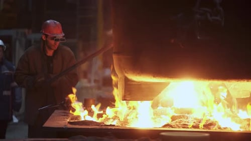 Witness the Intense and Dynamic Process of Metal Pouring in a Modern Industrial Foundry Setup Stock