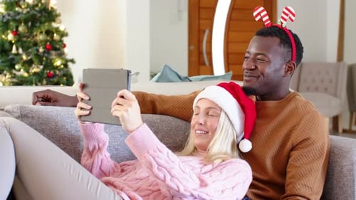Couple Celebrates Christmas with Tablet Video Call