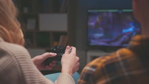 Couple Playing Video Game Together at Home