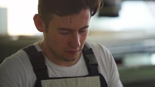 Electrician Assembles Electrical Panel Fuse Box in Workshop Worker Installs Energy Meter Switches