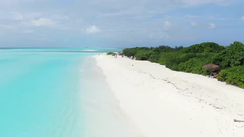 Aerial view of beach with white sand and turquoise water, Maldives.
