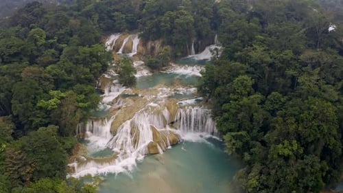 Aerial drone shot of the Agua Azul waterfalls and tourist facilities in Chiapas, Mexico