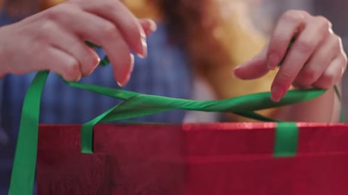 Close Up Hands Young Woman Hands Put Wrapped in Red Kraft Paper Gift Near the Christmas and New Year