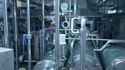 Close look at the pipelines with valves and barometer.