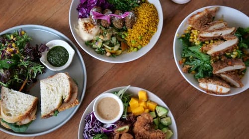 Variety of Healthy Food Bowls on Wooden Table