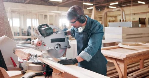 Saw, machine and carpenter in workshop with wood project in carpentry and process of cutting plank