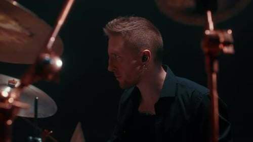 Portrait of Cool Drummer Playing Rock Handsome Man Beating Rhythm By Drumsticks Medium Shot with