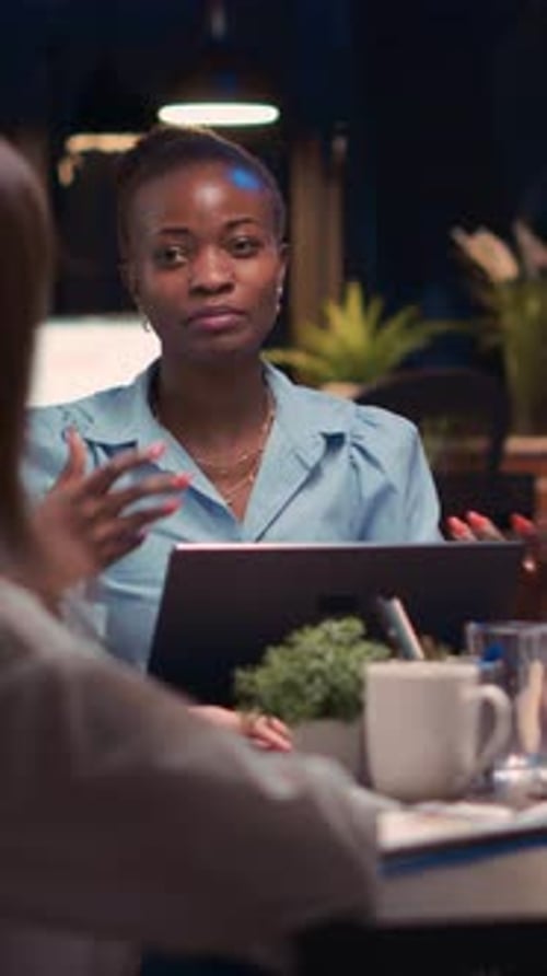 Coworkers Meeting in Modern Office Setting