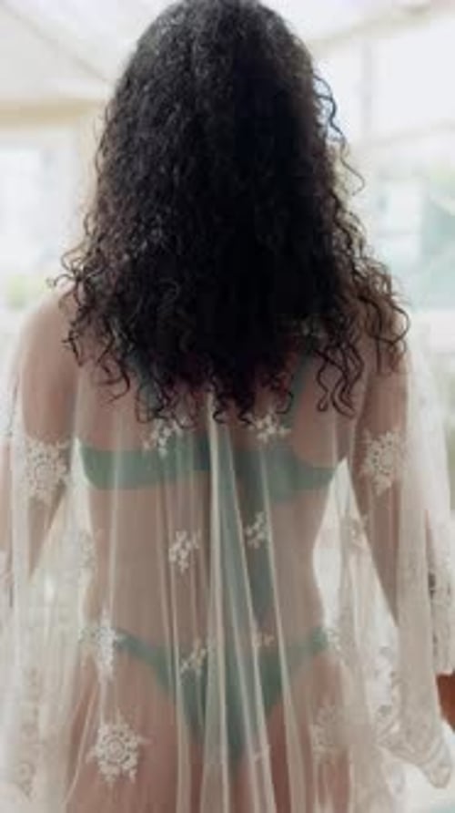 Back, walking or woman at resort with swimwear, luxury vacation or serenity at holiday destination