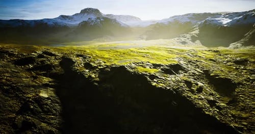 Cinematic Aerial Flight Over Rugged Mountain Landscape with Golden Light