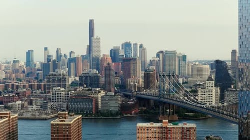 Aerial View of New York City's Manhattan Bridge and East River at Late Afternoon