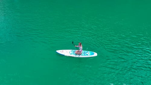Aerial View Journey on Paddleboards Through the Green Canyon People Relax and Paddle in the Sun