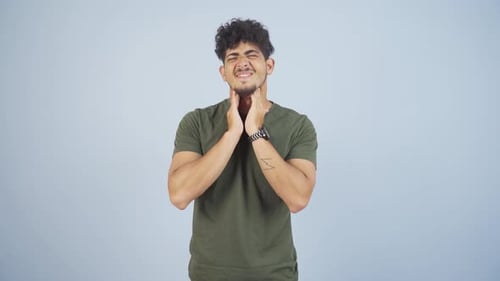 Young Adult with Sore Throat Symptoms