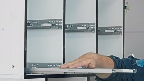 Member of the Staff at a Furniture Manufacturing Facility is Inspecting the Functionality of the