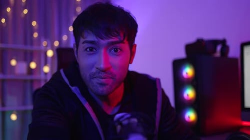 Man Talking into Microphone While Gaming at Home