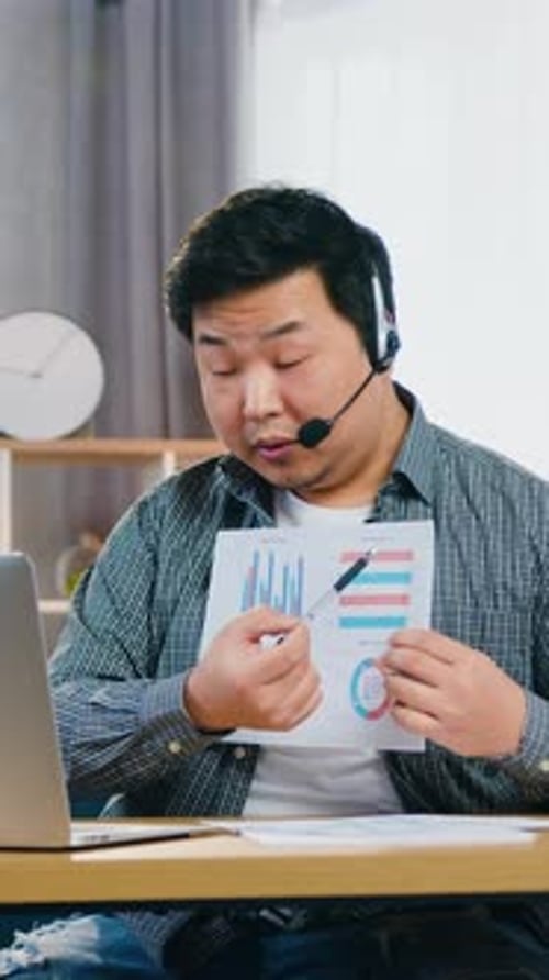 Man Presenting Business Charts During Video Call